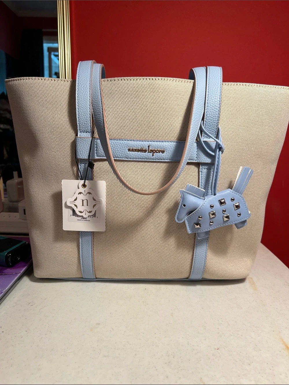 Nanette Lepore Beige Canvas Tote with Light Blue Leather Trim and Charm  RT,148